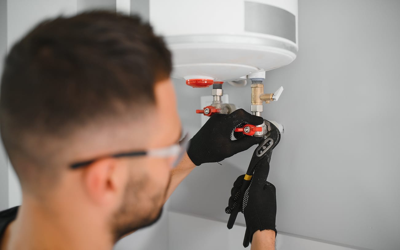 Plumber installing a fixture
